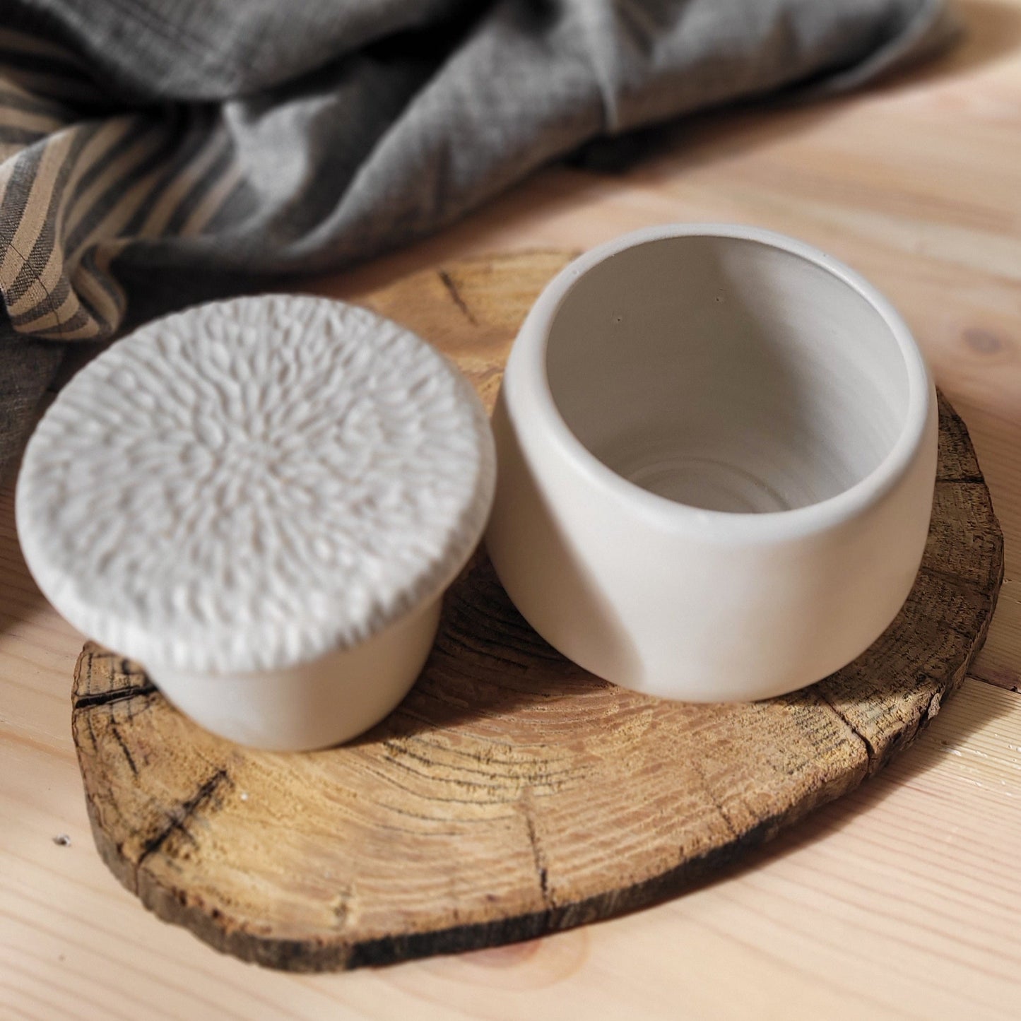 Elegant French Butter Dish: Matte white ceramic with a textured lid. Soft butter, naturally. (
