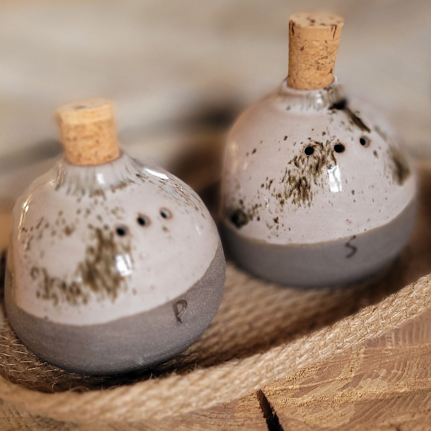 Ceramic Salt and Pepper jars- Set of two jars and jute basket. Gray with beige speckled glaze.