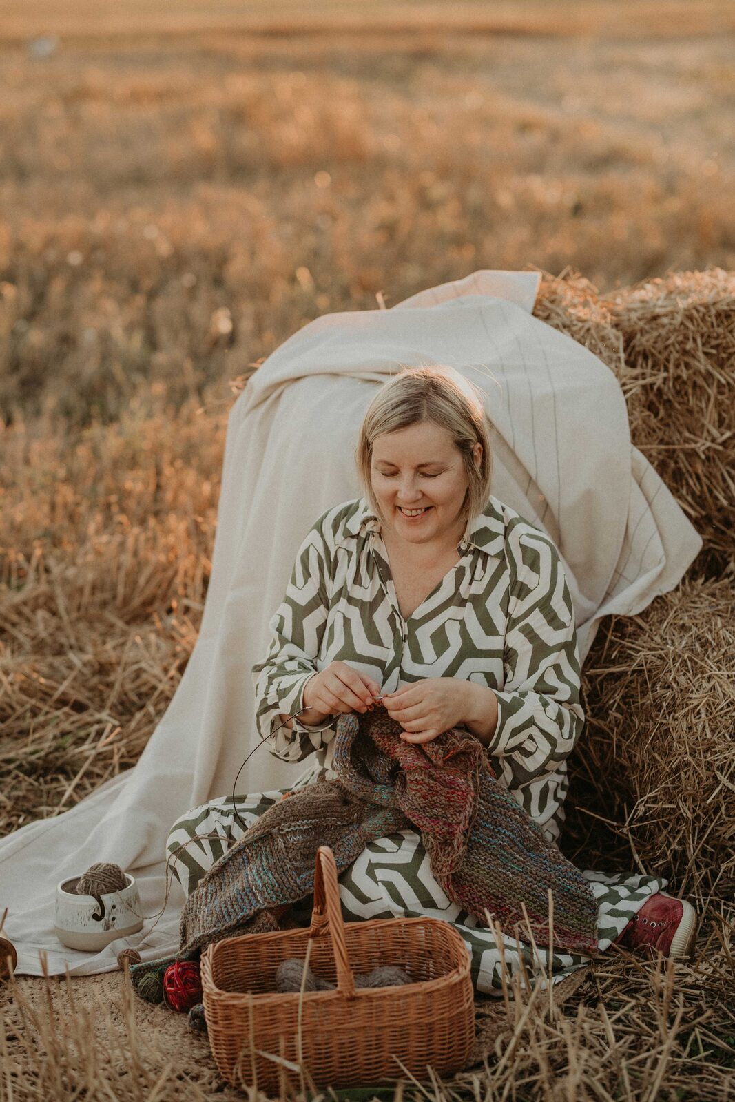 Handmade ceramic yarn bowl in use during a knitting session