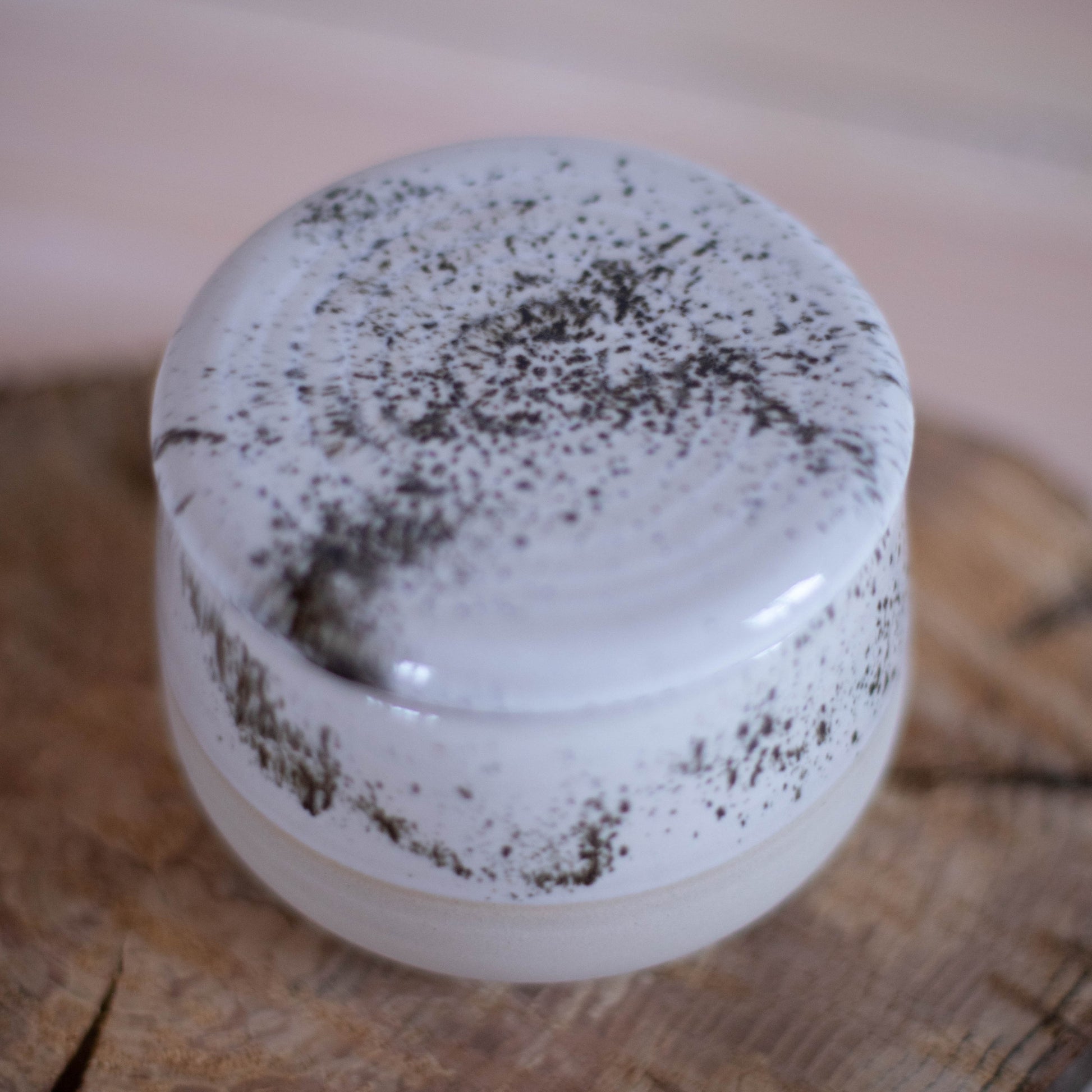 Close-up of the French butter dish, showing the intricate details of the speckled glaze.