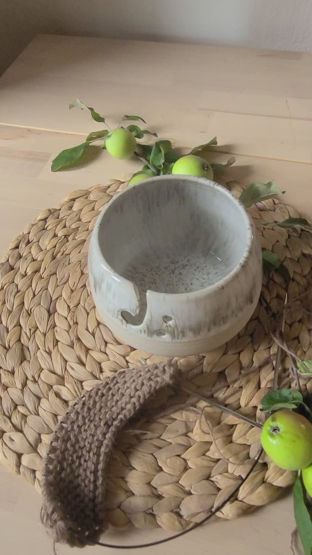 Artistic ceramic yarn bowl featuring a unique "White+ Creamy Speckled Glaze," a beautiful addition to your crafting space, enhancing your knitting and crochet experience.