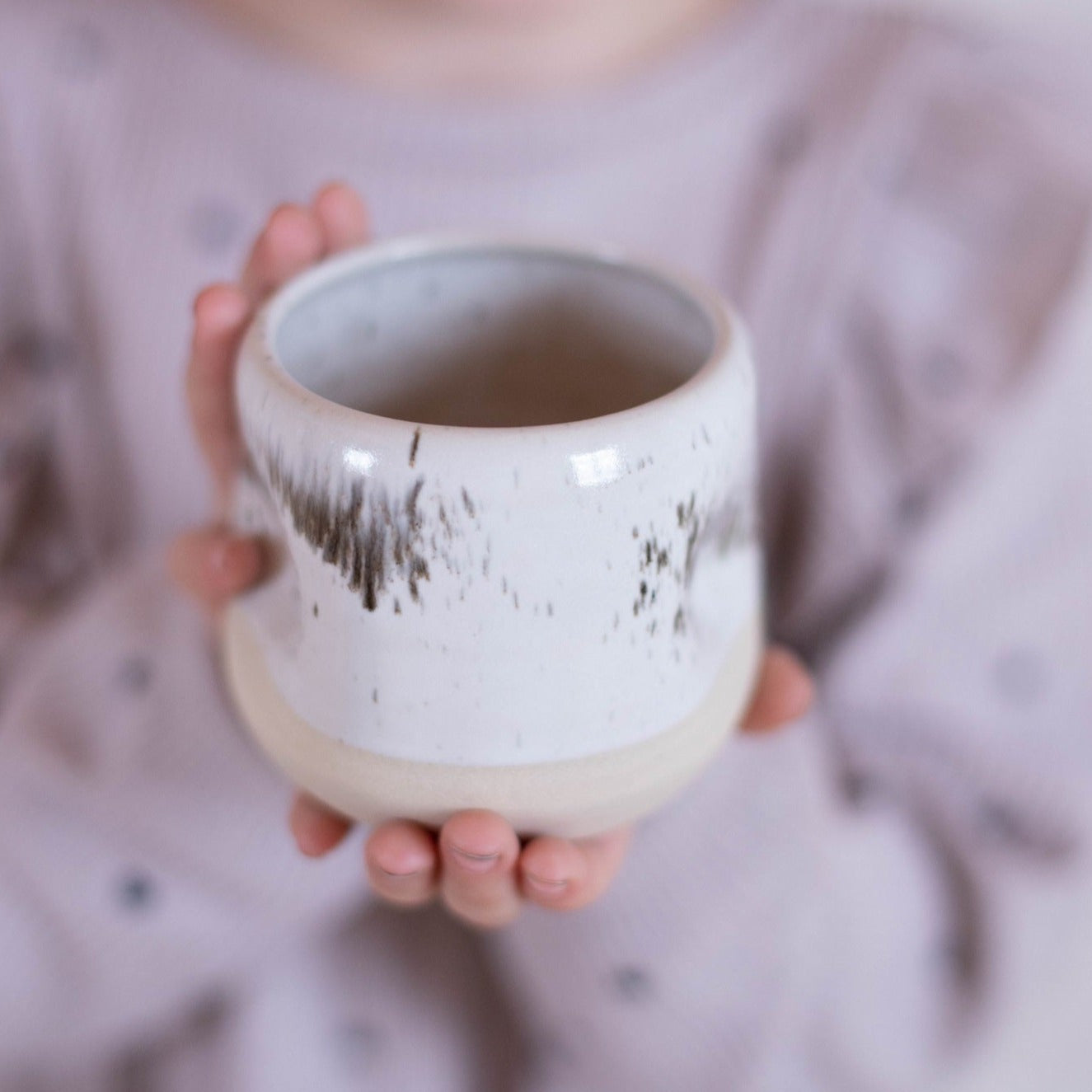 Coffee Lover's Mug: Sleek white espresso cup, speckled glaze adds a touch of charm.