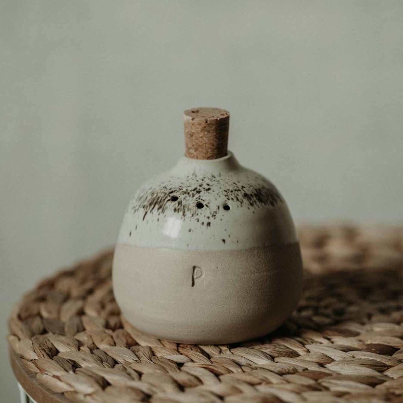 Beautifully crafted ceramic shakers in cream color for salt and pepper.