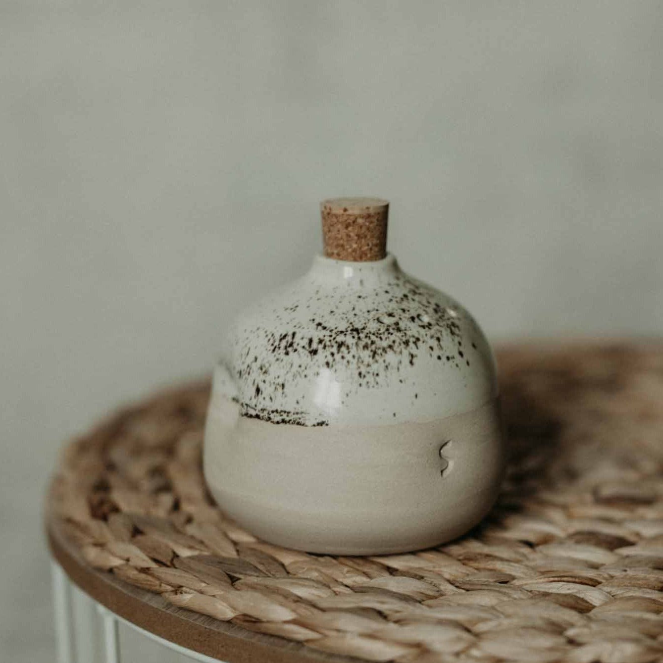Eco-friendly and artisanal ceramic shakers in cream tone, perfect for seasoning your dishes.