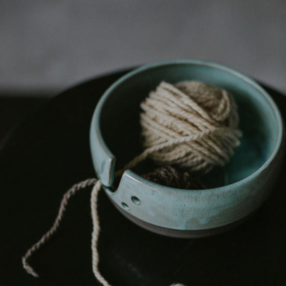 Handcrafted yarn organizer with a beautiful swirl design, making crafting a joyous experience.