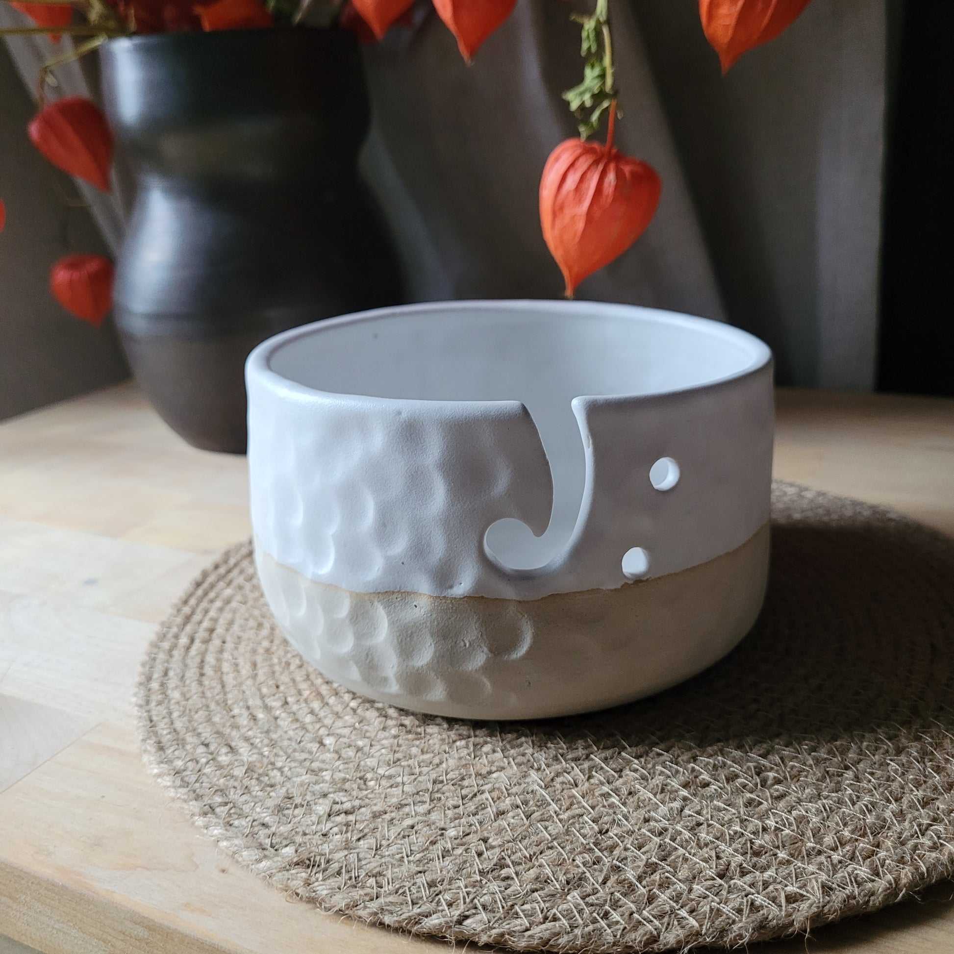 Eco-Friendly Ceramic Yarn Bowl - White with Matte Glaze and Textured Design. Crafted with care, this sustainable white yarn bowl features a matte glaze and a textured design. Keep your yarn organized and eco-conscious with this handmade ceramic piece, perfect for supporting a greener approach to your crafting adventures.
