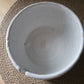White Yarn bowl with glaze imperfection.