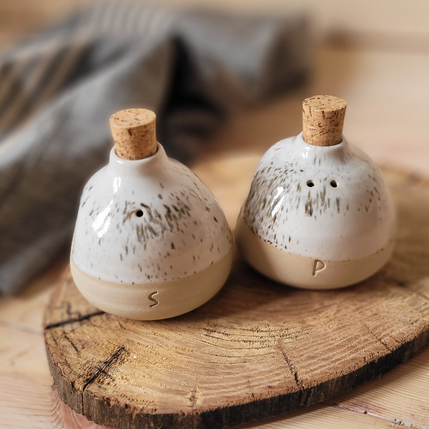 Spice Up Your Kitchen: Rustic pottery salt & pepper shakers. Enhance your table setting.