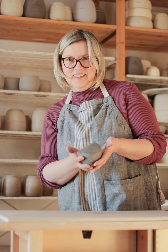 Ceramic vessel being hand-thrown on the pottery wheel in Jogita's studio