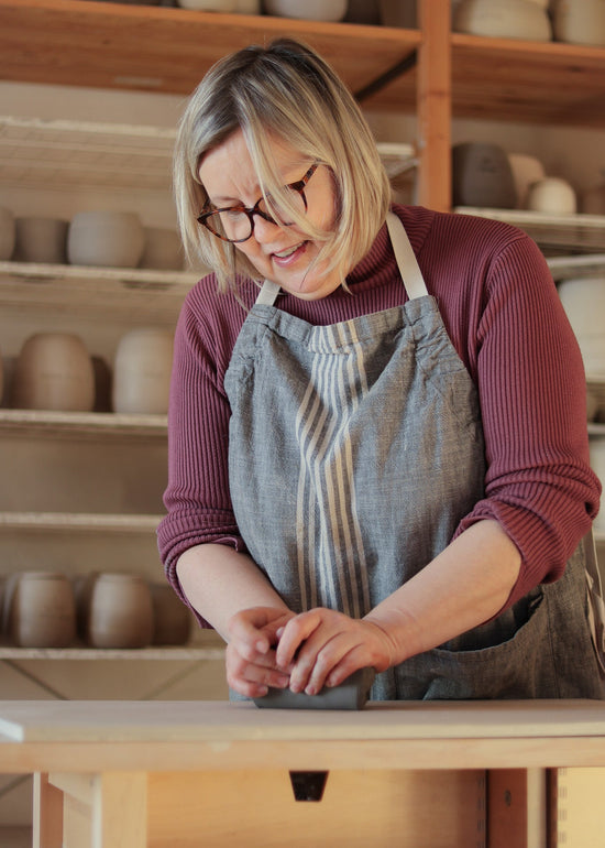 Freshly glazed ceramic pieces before kiln firing in Jogita's studio