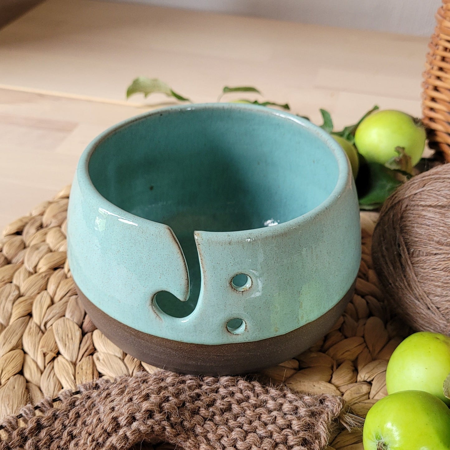 Handmade ceramic yarn bowl with gray base and turquoise green glaze