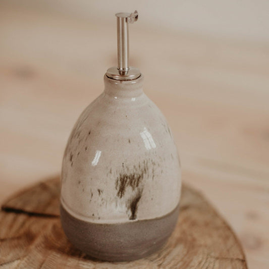 Exquisite handmade oil bottle with white-speckled glaze and gray matte clay