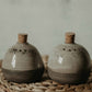 Get a unique and rustic look for your dinnerware with our modern minimalist style ceramic salt & pepper shakers set featuring a gray speckled glaze.