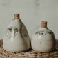 Add rustic style to your kitchen with this unique handmade stoneware oil pourer. Perfect for housewarming gifts and everyday kitchen use, the ceramic oil dispenser is sure to please.